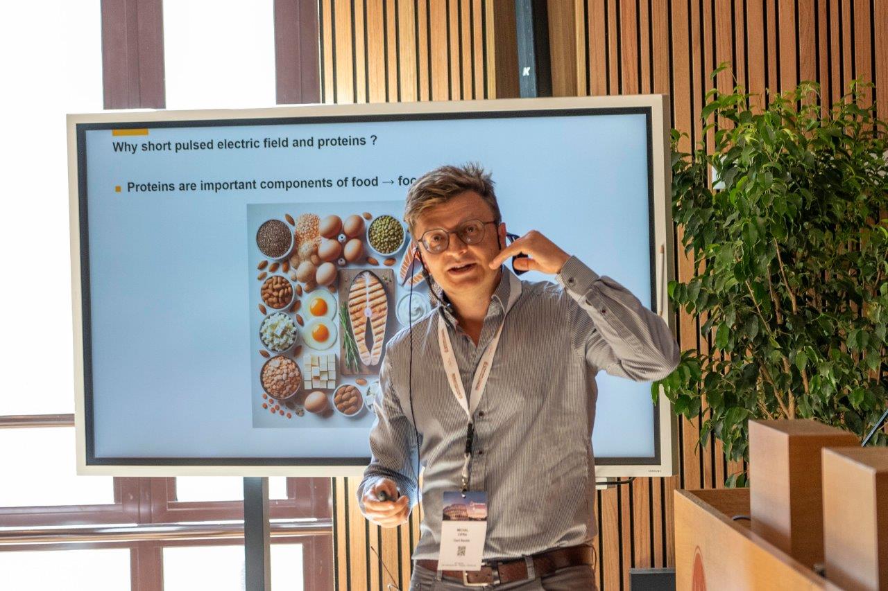 Michal Cifra speaking on short pulsed electric fields and proteins at the 2024 World Congress on Electroporation